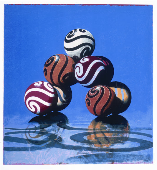 “Land Fall” by John Gibson, an abstract painting of a stack of colorful, patterned spheres against a vivid blue background. Suited for modern home décor, office art, and interior design.