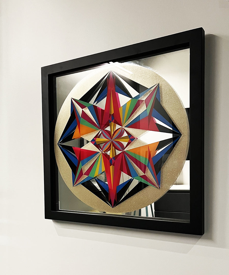 “Untitled” by Carlos Rolón/Dzine in a black frame hanging on a white wall.