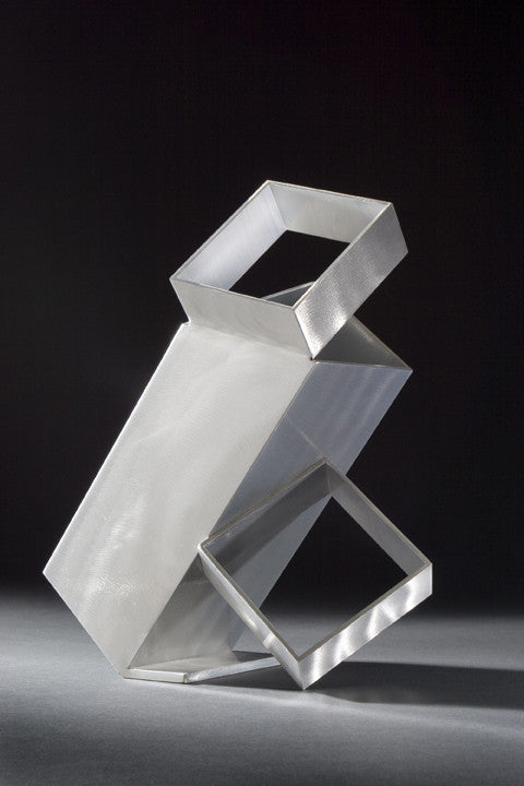 	“Box Trot” by Jane Manus, Painting of modern sculpture with geometric shapes made of reflective metal, featuring two interconnected rectangular frames at different angles, set against a dark background.
