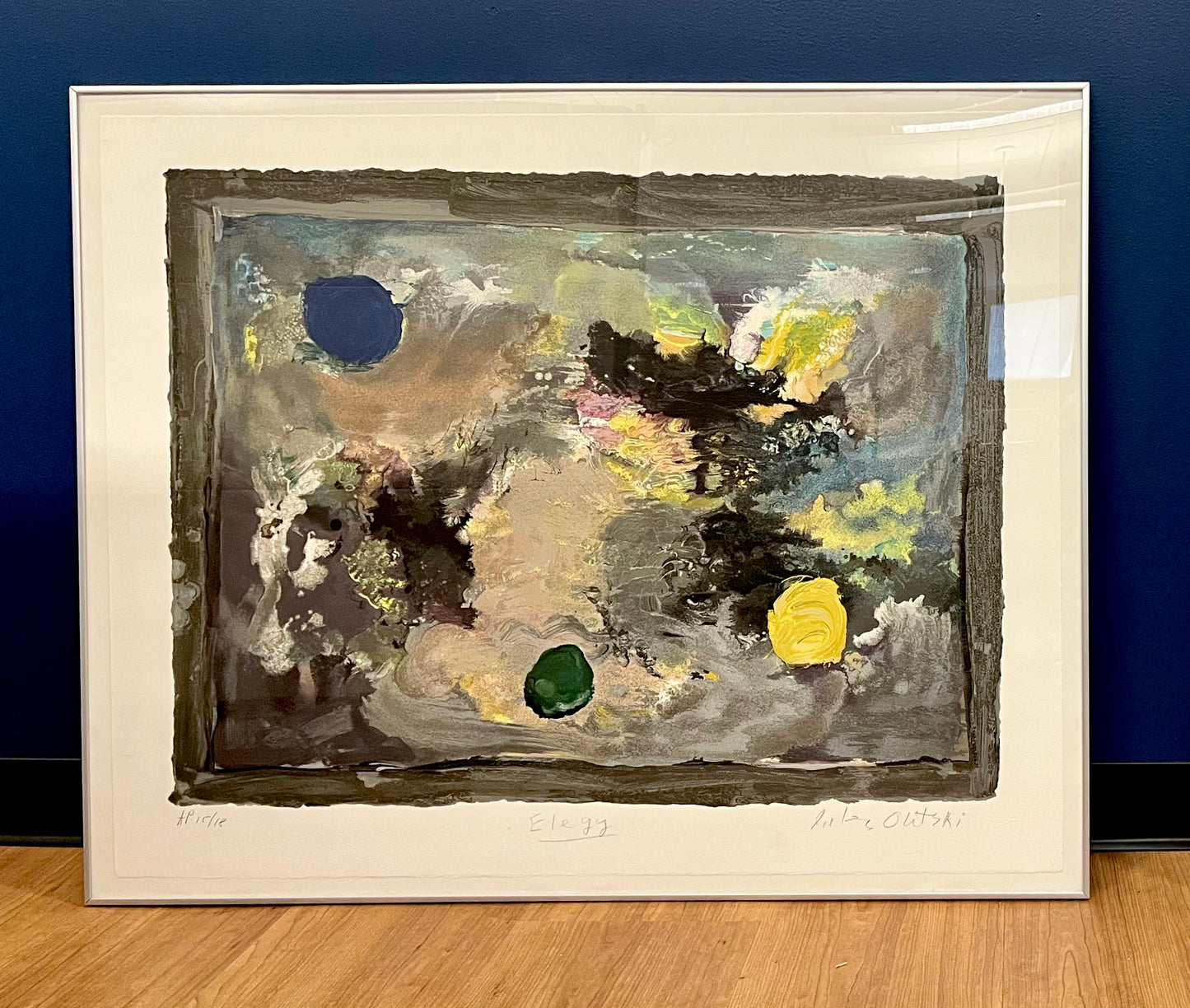 An abstract image with yellow, blue and green tones.