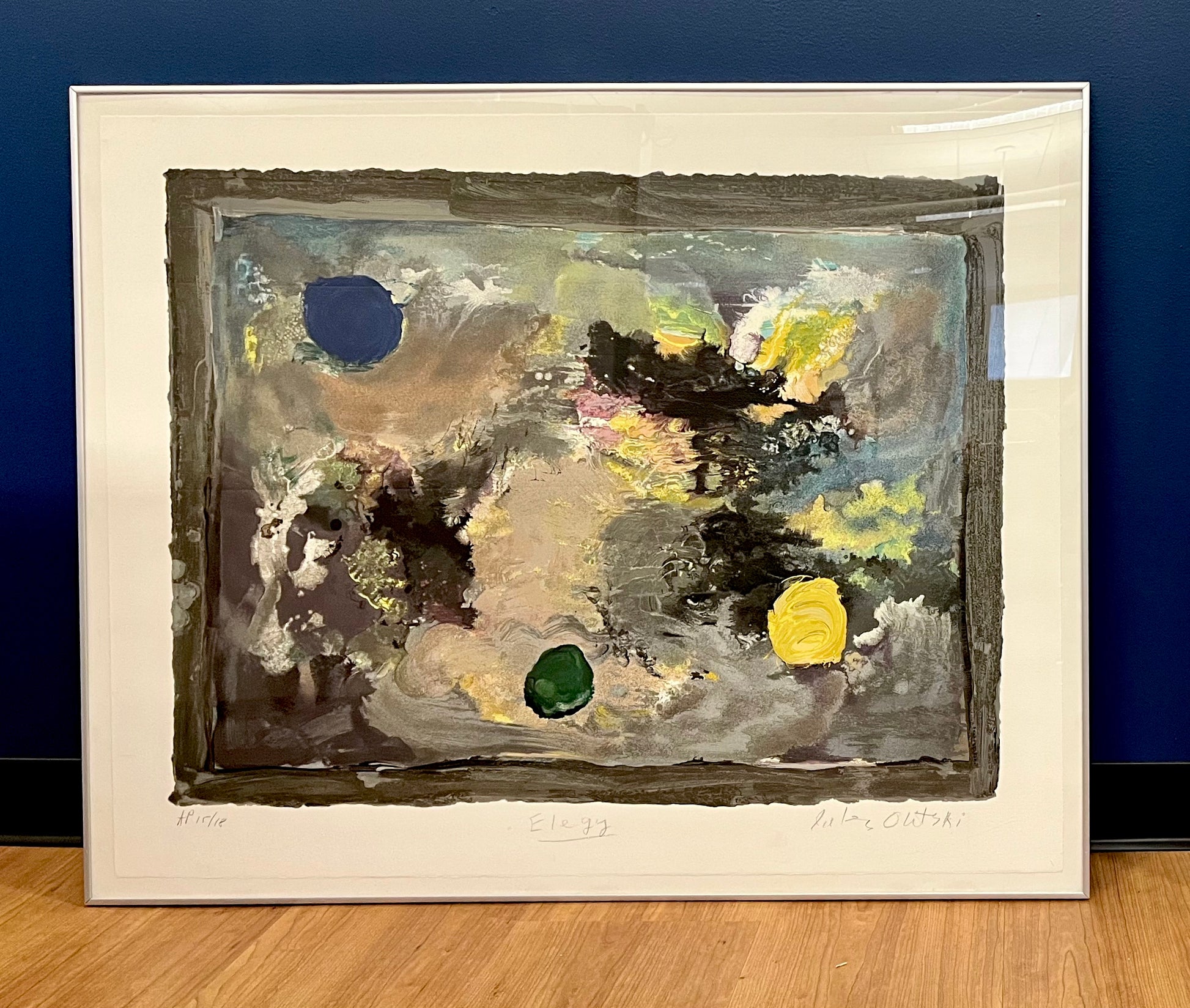 An abstract image with yellow, blue and green tones.