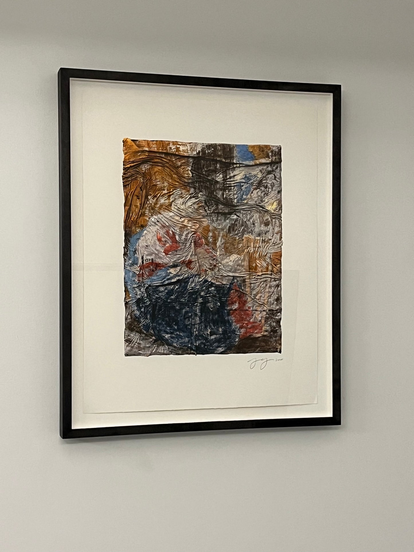 Photo of “Untitled (SK-PH)” in a black frame hanging on a white wall.