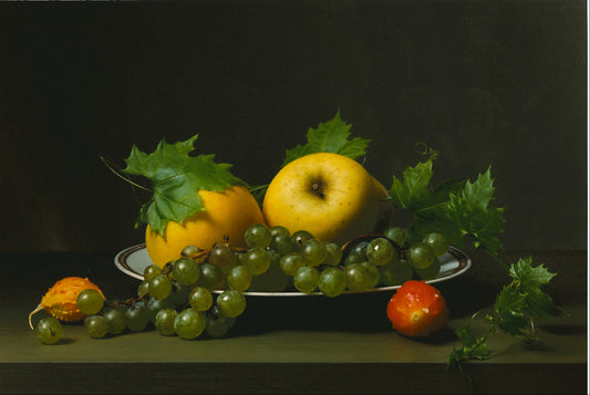 “Early American, Still Life with Balsam Apples” by Sharon Cole, Print of assorted fruits on a white porcelain plate with a brown rim. Captures two yellow balsam apples with leaves and a line of green shiny grapes against a black backdrop.